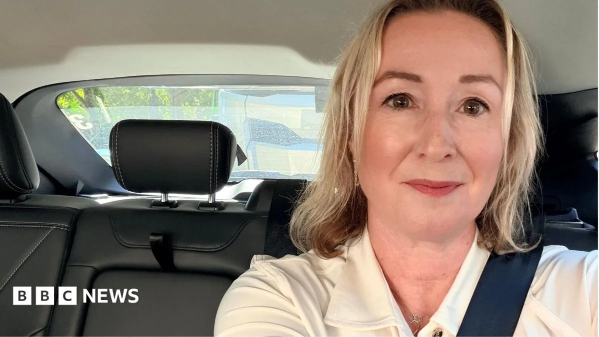 Uber self-driving car in London with a safety driver behind the wheel